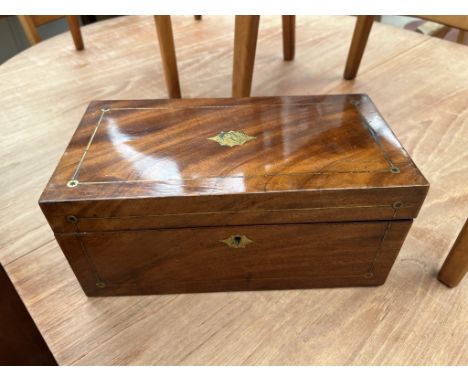 A 19th century mahogany tea caddy, of rectangular form with brass inlay with two lidded compartments to the interior 