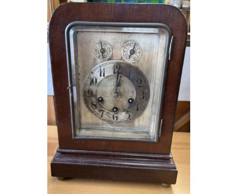 A Junghans mahogany bracket clock, with a silvered dial, Arabic numerals, Chime / Silent Dial, Slow / fast dial, striking on 