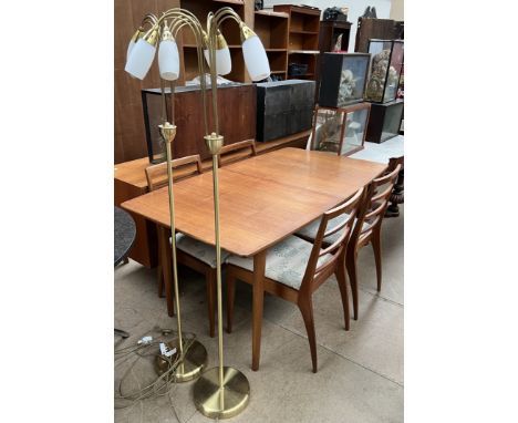 A mid 20th century teak A. H. McIntosh &amp; Co Ltd extending dining table together with four ladder back chairs and a pair o