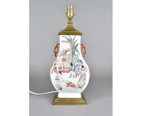 An 18th century Chinese porcelain famille rose vase, the twin handled vase now converted to a table lamp, with gilt metal mou