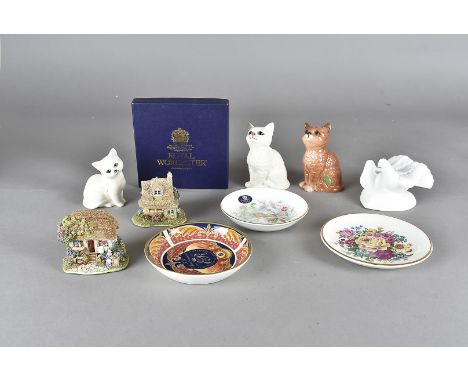 Two Beswick porcelain cat figures, together with a similar Royal Doulton example, plus a Royal Doulton 'Images Of Nature Devo