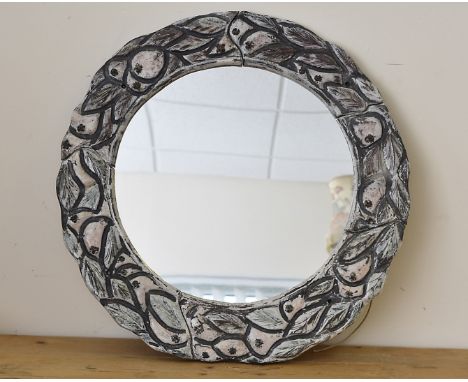 A 1950s mirror, having ceramic fruit and leaf surround, 59 cm diameter 