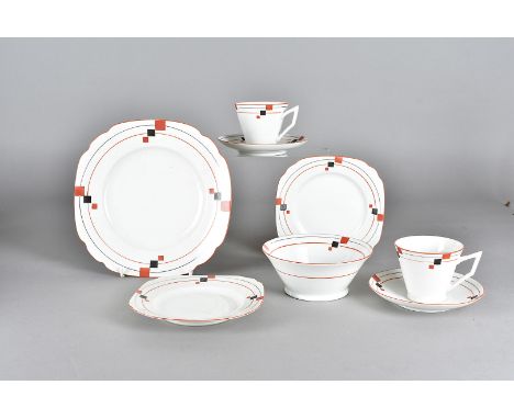 An Art Deco continental porcelain tea service, the red and black square and banded design on a white ground, comprising six c