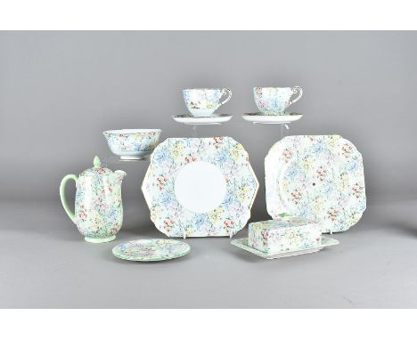 A large Shelley 'Melody' pattern tea set, comprising tea pot and cover, cups and saucers, sugar bowl, milk jug, butter dish, 