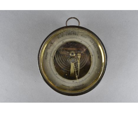 An Aneroid Barometer in a brass case by DC, the steel chapter ring with revealed mechanism, 13.5 cm  