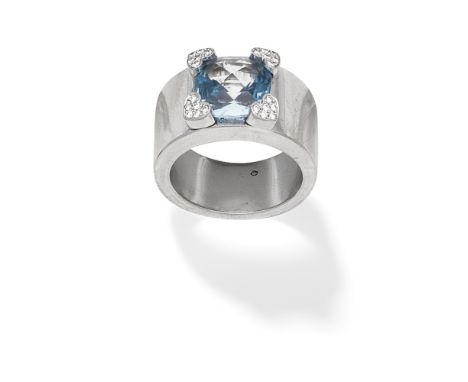 CHOPARD: TOPAZ AND DIAMOND-SET RINGThe cushion-shaped blue topaz with brilliant-cut diamond set heart-shaped claws,  signed C