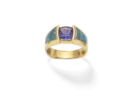 TANZANITE AND OPAL RINGThe cushion-shaped tanzanite set between opal inlaid shoulders, ring size approx. O½ (leading edge)For