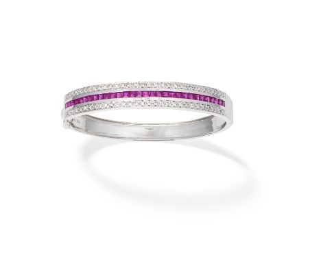 RUBY AND DIAMOND-SET BANGLEChannel-set to the front with square-cut rubies between two rows of brilliant-cut diamonds, mounte