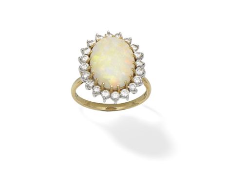 OPAL AND DIAMOND-SET CLUSTER RINGThe oval opal cabochon within a brilliant-cut diamond surround, mounted in 18 carat gold, Lo