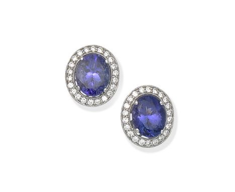 TANZANITE AND DIAMOND CLUSTER EARRINGSEach oval-cut tanzanite within a surround of brilliant-cut diamonds, diamonds approx. 0