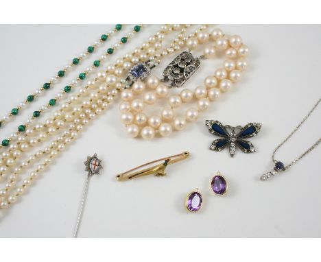 A QUANTITY OF JEWELLERY including a double row graduated cultured pearl necklace, set to a blue and white paste clasp, an ena