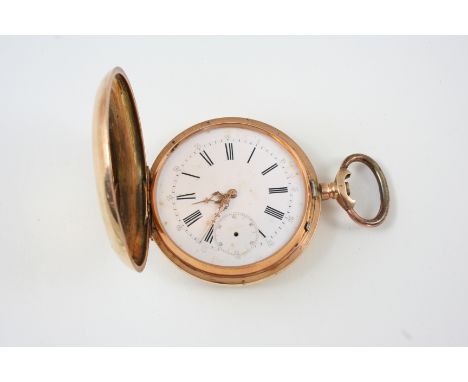 A 14CT. GOLD FULL HUNTING CASED POCKET WATCH the white enamel dial with Roman numerals and subsidiary seconds dial, glass mis