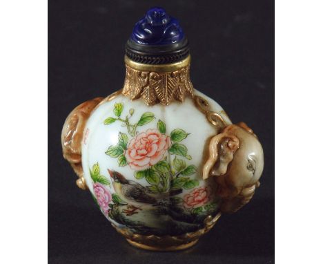 CHINESE PORCELAIN AND GILT METAL MOUNTED SNUFF BOTTLE, of melon form with elephant head handles and blue glass stopper, blue 