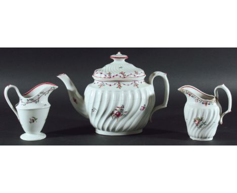 NEWHALL TEAPOT AND COVER, of wrythen form with floral painted decoration; together with two Newhall helmet form cream jugs an