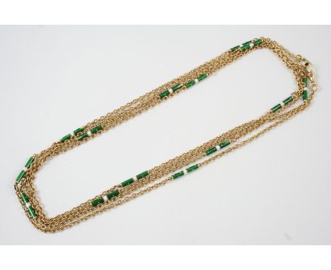 AN 18CT. GOLD AND ENAMEL LONG GUARD CHAIN the gold link chain is set with green and white enamel links, 166cm. long, 35 grams