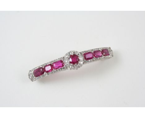 A RUBY AND DIAMOND BROOCH the central cluster set with a circular-cut ruby within a surround of old brilliant-cut diamonds, w