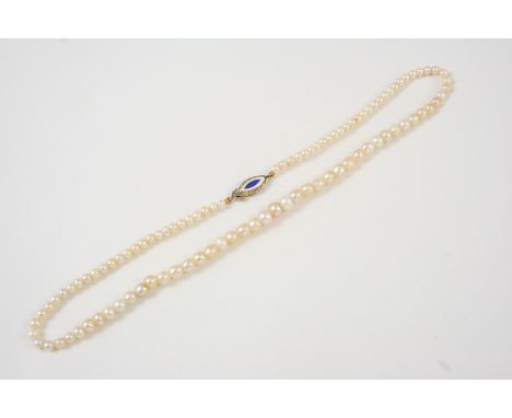 A SINGLE ROW NATURAL PEARL NECKLACE the pearls graduate to a an enamel and gold navette-shaped clasp, 34cm. long. Accompanied
