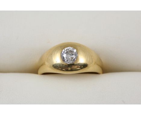 A DIAMOND AND GOLD RING the 18ct. gold band is set with an old brilliant-cut diamond. Size R.