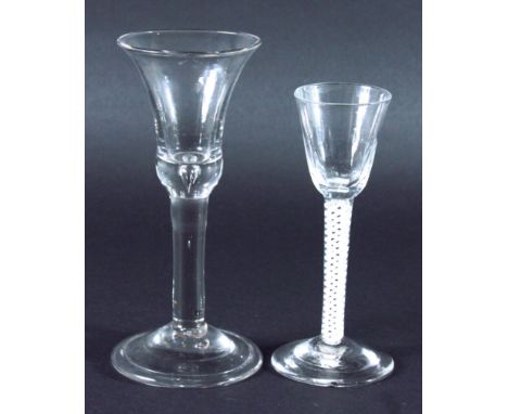 EIGHTEENTH CENTURY WINE GLASS, bell shaped bowl with basal air inclusion, plain stem, domed foot with folded over rim, 18cm; 