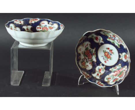 PAIR OF WORCESTER BOWLS, circa 1780, of shaped circular form, painted with chinoiserie style flowers in gilt cartouches on a 