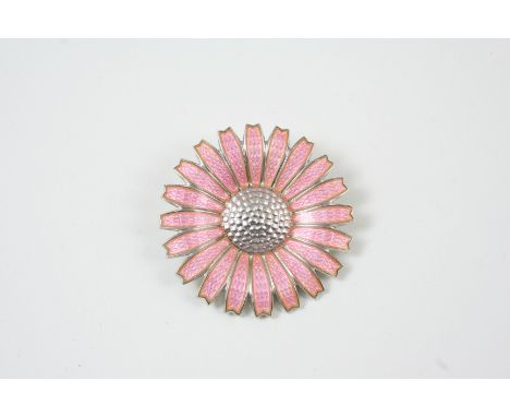 A PINK ENAMEL AND SILVER DAISY BROOCH BY GEORG JENSEN signed to the reverse, 4.5cm. dia.