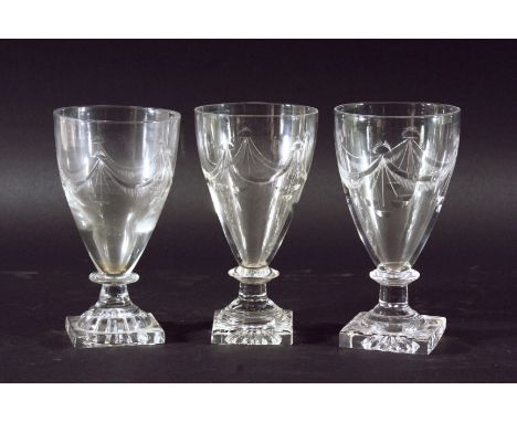 MATCHED SET OF EIGHT RUMMERS, late 18th century and later, the bowl of slender form with cut swag decoration above knopped st