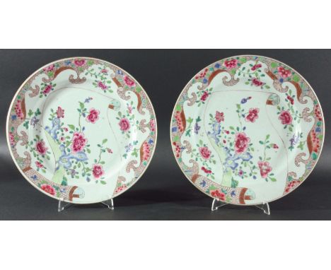 SET OF SIX CHINESE FAMILLE ROSE PLATES, late 18th century, decorated with flowers and rocks on a scroll, 29.5cm (6)