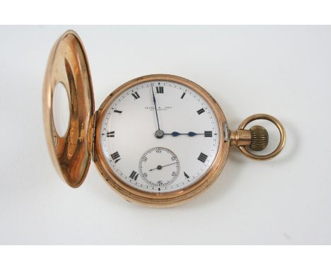 A 9CT. GOLD HALF HUNTING CASED POCKET WATCH the white enamel dial signed Searle & Sons Plymouth, with Roman numerals and subs