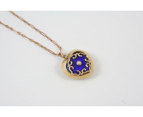 A VICTORIAN ENAMEL AND GOLD HEART-SHAPED LOCKET PENDANT the centre section of blue guilloche enamel centred with a small pear