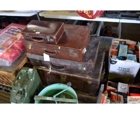 A small leather travel writing case, trunk and two other leather cases 