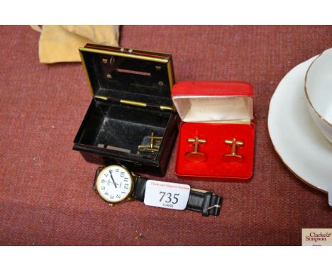 A Timex wrist watch and cufflinks