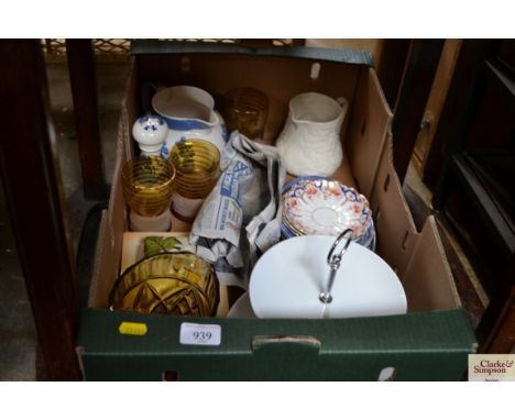 A box of sundry glass and china to include Amber glass jug; cake plate; 19th Century gilt and floral saucers etc
