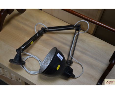 A wall mounted angle poise style lamp 