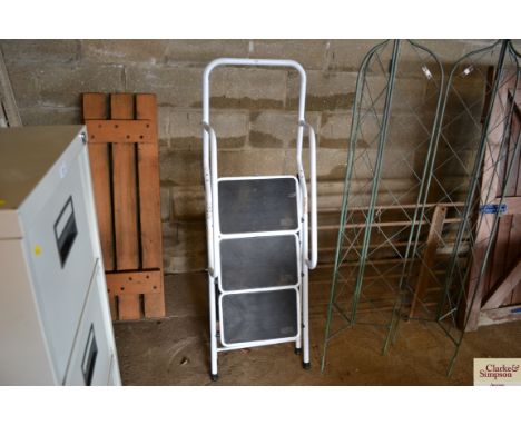 A set of modern white steps with handrail 