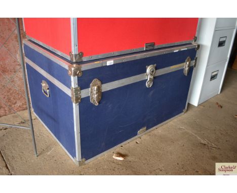 A large blue packing trunk