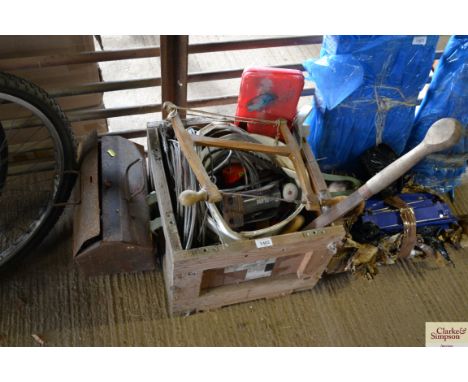 A wooden box containing various tools, wire and a small metal toolbox and contents 