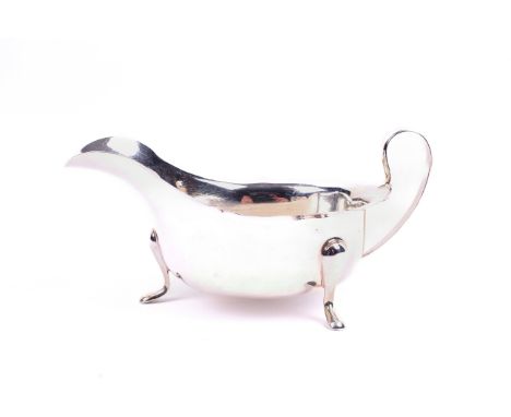 A silver sauce boat. With fluted rim, hallmarks for Sheffield 1933, Viners Ltd. Weight 3.29 oz., boxed. 