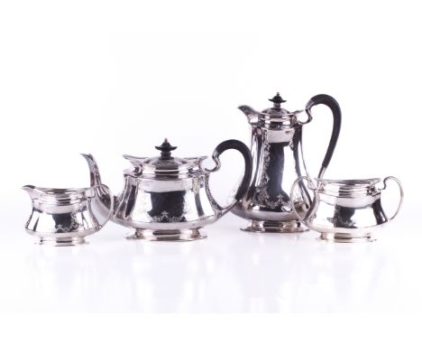 An early 20th century four piece tea and coffee set. All of gentle quatrefoil form, panels decorated with scrolls and flowers