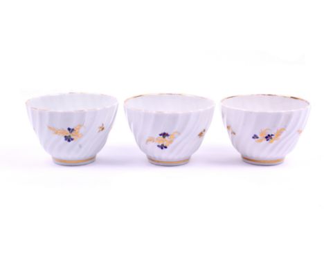 Three circa 1800 Royal Worcester Flight &amp; Barr tea bowls. Of fluted form decorated and gilt with blue cornflower-like spr