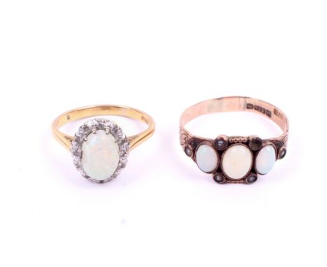 Two 20th century opal set gold dress rings. One hallmarked 9ct gold, size P, 1.7g gross. The second a cluster ring marked '18