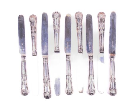 Nine matching Victorian silver Kings Pattern knives. Six with hallmarks for John Gilbert, Birmingham 1862, and three with hal