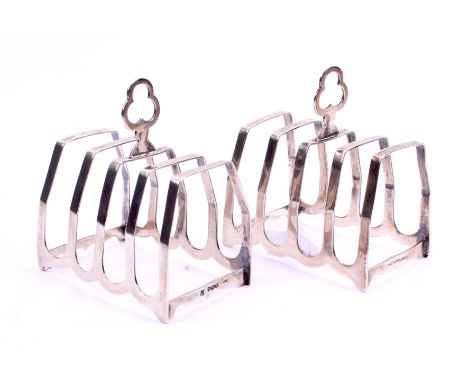 A pair of George VI silver toast racks. Cooper Brothers & Sons Ltd, Sheffield 1947, each having four sections and a pierced h