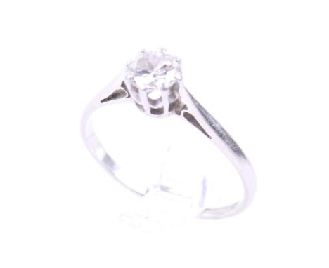 A mid-20th century gold and diamond solitaire ring. The round brilliant approx. 0.40cts, claw set in white on a D-section sha