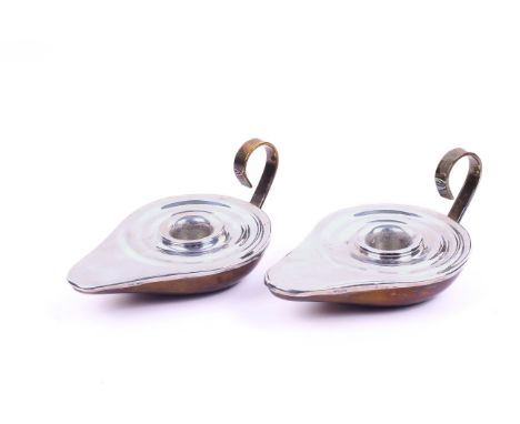 A pair of silver and gilt metal candlestick holders. Of traditional form, with concentric fluting around the recess, marked 0