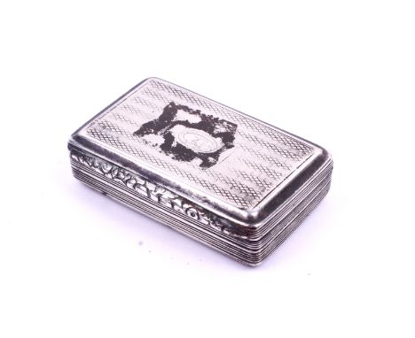 A George IV snuff box. Marked Birmingham 1828, rectangular with engine turned decoration and a moulded floral rim, L6cm, 48.1