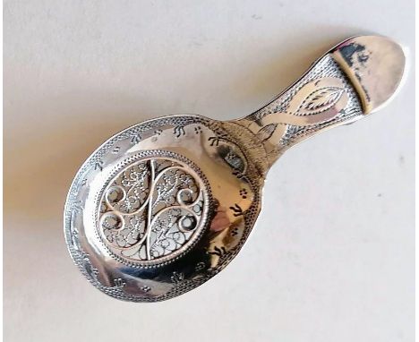 A George III silver caddy spoon with elaborate filigree decoration by Samuel Pemberton, Birmingham, 1804, 7cm