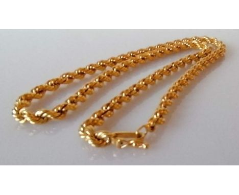 A gold rope twist neck chain, 46 cm, unmarked, test for 18ct gold, 23.6g 