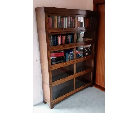 A matching set of three Art Deco oak-stained barrister bookcases in the Globe Wernicke style, the largest 182 h x 87 w x 28 d