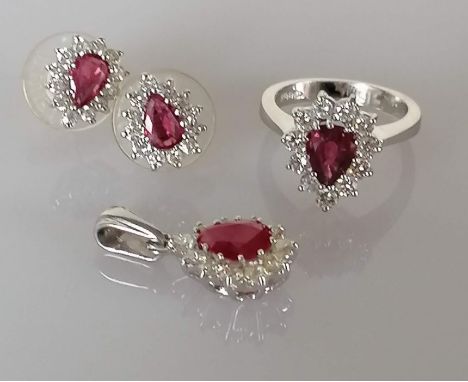 A ruby and diamond parure on a white gold setting comprising of a pendant, 2.8g, 24mm, approximate diamond/ruby weight 0.77/1