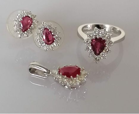 A ruby and diamond parure on a white gold setting comprising of a pendant, 2.8g, 24mm, approximate diamond/ruby weight 0.77/1